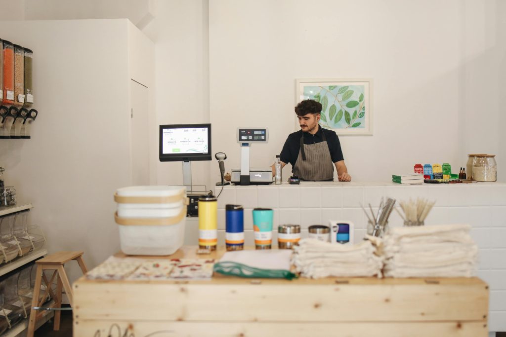 A man setting up his shop to start his small business.