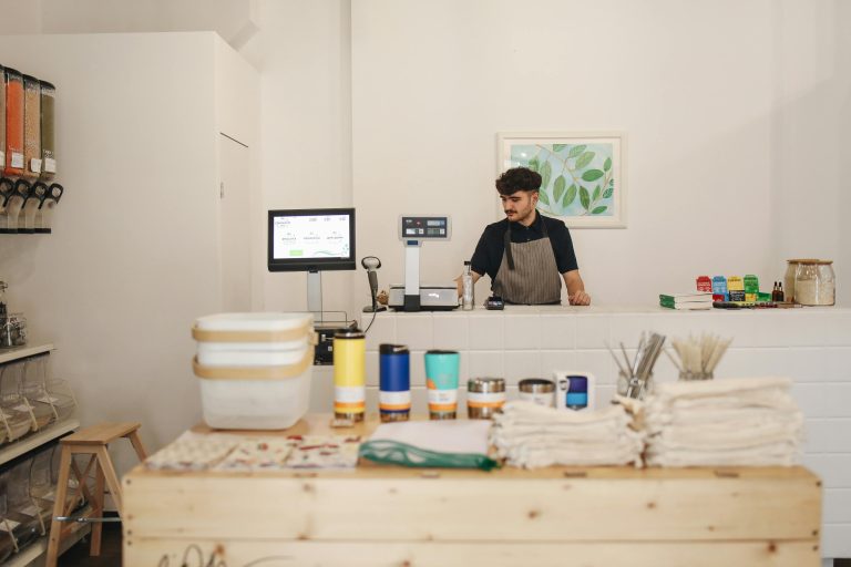 A man setting up his shop to start his small business.